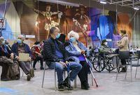 Seniors wait after receiving a first dose of COVID-19 vaccine at a vaccination clinic in Montreal on Wednesday, March 10, 2021. Health Canada has approved the first vaccine for respiratory syncytial virus (RSV) for adults age 60 and over. THE CANADIAN PRESS/Paul Chiasson