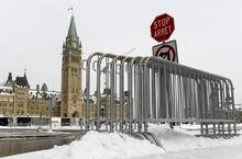 Ottawa city council has approved a motion to reopen Wellington Street to traffic over a year after it was closed off following the "Freedom Convoy." Fencing is seen on Parliament Hill in Ottawa, one year after the Freedom Convoy protests took place, on Friday, Jan. 27, 2023. THE CANADIAN PRESS/Justin Tang