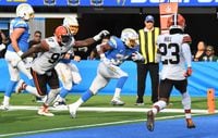 Oct 10, 2021; Inglewood, California, USA; Los Angeles Chargers running back Austin Ekeler (30) scores a touchdown against the Cleveland Browns  in the second half at SoFi Stadium. Mandatory Credit: Richard Mackson-USA TODAY Sports