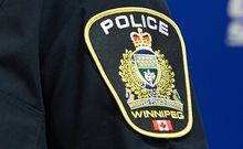 A Winnipeg Police Service shoulder badge is seen on Sept. 2, 2021 at the Public Information Office in Winnipeg. Police have identified partial remains found last month along the Red River north of Winnipeg's downtown as belonging to 40-year-old June Johnson. THE CANADIAN PRESS/David Lipnowski