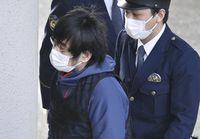 Tetsuya Yamagami, the alleged assassin of Japan's former Prime Minister Shinzo Abe, enters a police station in Nara, western Japan, on Jan. 10, 2023. Japanese prosecutors formally charged the suspect in the assassination of former Prime Minister Shinzo Abe with murder, Japan's NHK public television reported Friday, Jan. 13, 2023. (Kyodo News via AP)