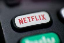 This Aug. 13, 2020 photo shows a logo for Netflix on a remote control in Portland, Ore. Canadians who spent the month sorting out how to untangle Netflix accounts shared by loved ones after new policies came into effect this week should get used to the debacle. THE CANADIAN PRESS/AP/Jenny Kane