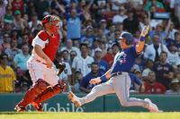 BOSTON, MA - JULY 23: Cavan Biggio #8 of the Toronto Blue Jays slides home safely for a run as catcher Kevin Plawecki #25 of the Boston Red Sox waits for the throw during the third inning at Fenway Park on July 23, 2022 in Boston, Massachusetts. (Photo By Winslow Townson/Getty Images)