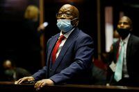 Former South African President Jacob Zuma stands in the dock after recess in his corruption trial in Pietermaritzburg, South Africa, May 26, 2021. Phill Magakoe/Pool via REUTERS
