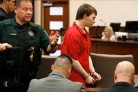 Aiden Fucci is led into the courtroom start his sentencing hearing, Friday, March 24, 2023. in St. Augustine, Fla. A Florida judge sentenced the 16-year-old Florida boy to life in prison on Friday for fatally stabbing a 13-year-old classmate on Mother's Day in 2021. Fucci, who pleaded guilty just before his trial was set to start in February, was not eligible for the death penalty. (Bob Self/The Florida Times-Union via AP)