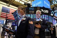 Traders work on the floor of the New York Stock Exchange (NYSE) on March 16.