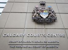 A coat of arms adorns the Calgary Courts Centre in Calgary on January 18, 2019. A Calgary man who bilked his clients out of millions of dollars in a Ponzi scheme has been sentenced to 10 years in prison for what the judge called a deliberate and large-scale fraud. THE CANADIAN PRESS/Jeff McIntosh