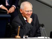 FILE PHOTO: Newly elected Bundestagsraesident Wolfgang Schaeuble, smiles as he conducts the first plenary session at the German lower house of Parliament, Bundestag, after a general election in Berlin, Germany, October 24, 2017. REUTERS/Hannibal Hanschke/File Photo