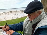 Acadian poet Raymond Guy LeBlanc writing at St. Andrew’s by the Sea, undated. Courtesy of the Family