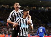 Newcastle United's Ayoze Perez celebrates with Miguel Almiron during a Premier League match against Leicester City, at King Power Stadium, in Leicester, Britain, on April 12, 2019.