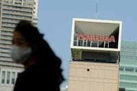 The logo of Japanese industrial group Toshiba is seen on top of its headquarters in Tokyo on April 7, 2021. (Photo by Kazuhiro NOGI / AFP) (Photo by KAZUHIRO NOGI/AFP via Getty Images)