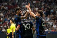 San Jose Earthquakes forward Cristian Espinoza (10) celebrates his goal against the Vancouver Whitecaps with teammates Rodrigues (26) and Cade Cowell (44) during first half MLS soccer action in Vancouver on Sunday, August 20, 2023. THE CANADIAN PRESS/Ethan Cairns