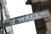 A street sign marks Wall Street outside the New York Stock Exchange (NYSE) in New York City in February of 2022.