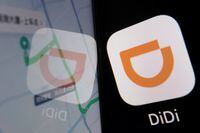 FILE PHOTO: The app logo of Chinese ride-hailing giant Didi is seen reflected on its navigation map displayed on a mobile phone in this illustration picture taken July 1, 2021. REUTERS/Florence Lo/Illustration/File Photo