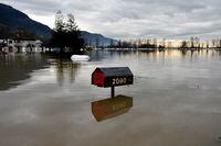 FILE PHOTO: Floodwater is seen a week after rainstorms lashed the western Canadian province of British Columbia, triggering landslides and floods, shutting highways, in Abbottsford, British Columbia, Canada November 22, 2021.  REUTERS/Jennifer Gauthier/File Photo