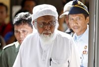 Abu Bakar Bashir enters a courtroom for the first day of an appeal hearing in Cilacap, Central Java province, Indonesia, on Jan. 12, 2016.