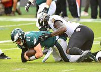 Baltimore Ravens defensive end Jihad Ward sacks Philadelphia Eagles quarterback Carson Wentz at Lincoln Financial Field on Oct. 18, 2020. Wentz and the Eagles could move atop the NFC East with a win over the New York Giants on Thursday night.