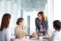   ROYALTY-FREE -- ISTOCKPHOTO.  Image of four successful businesswomen interacting at meeting