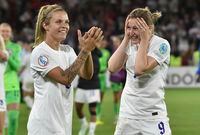 England's Leah Williamson, left, and Ellen White celebrate as they won the Women Euro 2022 semi final soccer match between England and Sweden at the Bramall Lane Stadium in Sheffield, England, Tuesday, July 26, 2022. (AP Photo/Rui Vieira)