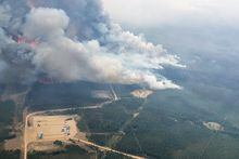 Smoke rises from areas on the southeast side of wildfire EWF-035, part of the Deep Creek Wildfire Complex which is being tackled by helicopters near Shining Bank, Alberta, Canada May 19, 2023. Alberta Wildfire/Handout via REUTERS   THIS IMAGE HAS BEEN SUPPLIED BY A THIRD PARTY.
