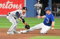 Apr 29, 2022; Toronto, Ontario, CAN; Toronto Blue Jays third baseman Matt Chapman (26) slides safely into second base advancing on a passed ball ahead of the tag from Houston Astros second baseman Aledmys Diaz (16) in the fifth inning at Rogers Centre. Mandatory Credit: Dan Hamilton-USA TODAY Sports
