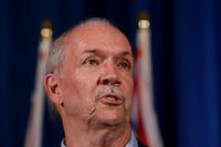 B.C. Premier John Horgan speaks during a press conference at the summer meeting of the Canada's Premiers at the Fairmont Empress in Victoria, Monday, July 11, 2022 THE CANADIAN PRESS/Chad Hipolito 