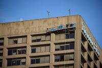 Letters of the Toronto Star sign at One Yonge Street are removed from the building in late December. The newspaper moved to new offices at Front and Spadina in Toronto.December 21, 2022(Melissa Tait/The Globe and Mail)