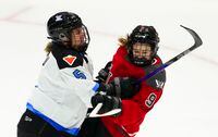 Toronto's Lauriane Rougeau (5) hits Ottawa's Daryl Watts (9) during third period PWHL hockey action in Ottawa on Tuesday, Jan. 23, 2024. THE CANADIAN PRESS/Sean Kilpatrick