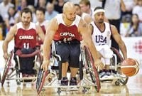 Canada's forward David Eng (15) chases down a loose ball against The United States during second-half men's gold medal wheelchair basketball action at the Parapan Am Games in Toronto on Saturday, August 15, 2015.