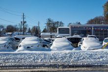 Cars are covered in snow at a dealership in Fort Erie, Ontario, Canada November 20, 2022 REUTERS/Carlos Osorio