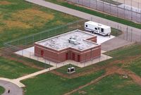 FILE - In this June 11, 2001 file photo, an aerial view of the execution facility at the United States Penitentiary in Terre Haute, Ind., is shown. After the latest 17-year hiatus, the Trump administration wants to restart federal executions this month at the Terre Haute, prison. Four men are slated to die. All are accused of murdering children in cases out of Arkansas, Kansas Iowa and Missouri. (AP Photo/Michael Conroy File)