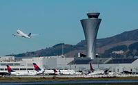 The air traffic control tower as a plane takes off from San Francisco International Airport, on Oct. 24, 2107.