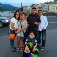 In this summer 2016 photo provided by Maria Elena Cardenas shows her, far left, and her husband Gustavo Cardenas, far right, with their children Maria, left, Gus, right, and Sergio, below, as they vacation in Austria. Since Venezuela's government arrested Gustavo and five other Citgo employees in November 2017 in Caracas, their 18-year-old son Sergio, who suffers from a rare metabolic disease called mucolipidosis, has been having panic attacks and screaming at night for his Dad. Maria fears that he could die before his father’s release. (Maria Elena Cardenas via AP)