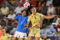 Italy's defender Elena Linari (L) vies against Belgium's striker Tine De Caigny to header the ball during the UEFA Women's Euro 2022 Group D football match between Italy and Belgium at Manchester City Academy Stadium in Manchester, north-west England on July 18, 2022. - Belgium won the match 1-0. (Photo by Daniel MIHAILESCU / AFP) / No use as moving pictures or quasi-video streaming. 
Photos must therefore be posted with an interval of at least 20 seconds. (Photo by DANIEL MIHAILESCU/AFP via Getty Images)