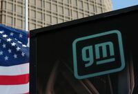 FILE PHOTO: The GM logo is seen on the facade of the General Motors headquarters in Detroit, Michigan, U.S., March 16, 2021. REUTERS/Rebecca Cook