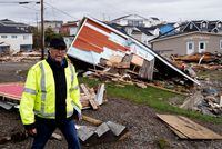 Port Aux Basques Mayor Brian Button walks through the town examining damage after the arrival of Hurricane Fiona in Port Aux Basques, Newfoundland, Canada September 25, 2022. REUTERS/John Morris