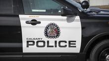 Police vehicles is shown at Calgary police headquarters on April 9, 2020. Alberta's police watchdog says a man who was shot by Calgary police last month had struck one of the officers with a long, metal spike. THE CANADIAN PRESS/Jeff McIntosh