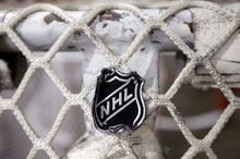 The NHL's plan appears robust and detailed. Once players enter so-called "bubbles" in two hub cities later this month as part of the league's plan to resuscitate its pandemic-halted season, teams should -- in theory -- be fairly well-protected from the threat of COVID-19. The NHL logo is seen on a goal at a Nashville Predators practice rink in Nashville, Tenn. on Sept. 17, 2012. THE CANADIAN PRESS/AP/Mark Humphrey