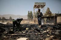 FILE - Yemeni police inspect a site of Saudi-led airstrikes targeting two houses in Sanaa, Yemen, Saturday, March 26, 2022.   Yemen's warring sides have accepted a two-month truce, starting with the Muslim holy month of Ramadan, the U.N. envoy to Yemen said Friday, April 1.  The envoy, Hans Grundberg, announced the agreement from Amman, Jordan, after meeting separately with both sides in the country's brutal civil war in recent days. He said that he hoped the truce would be renewed after two months. (AP Photo/Hani Mohammed, File)
