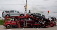 2019 Chrysler Pacifica minivans are seen on a transport truck leaving the FCA Windsor Assembly Plant in Windsor, Ont., on Oct. 5, 2018.