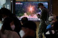 FILE PHOTO: A South Korean soldiers walks past a TV broadcasting a news report on North Korea firing a ballistic missile towards the sea off its east coast, in Seoul, South Korea, September 25, 2022.   REUTERS/Kim Hong-Ji/File Photo