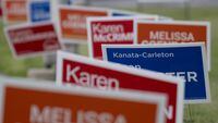 Campaign signs for provincial byelections in the riding of Kanata-Carleton are seen, Thursday, July 20, 2023 in Ottawa. Summer is the time for barbecues, bare feet and beaches, and, for residents of two Toronto and Ottawa-area ridings, byelections. THE CANADIAN PRESS/Adrian Wyld