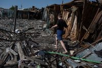 A local walks at a compound of a municipal market destroyed by a Russian military strike, amid Russia's attack on Ukraine, in the border town of Vovchansk, in Kharkiv region, Ukraine June 4, 2023. REUTERS/Viacheslav Ratynskyi