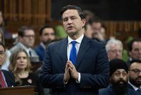 Liberals are accusing Conservatives of delaying help for Ukrainians, after a Tory motion prevented the House of Commons from voting today on a bill meant to modernize the Canada-Ukraine free trade agreement. Conservative leader Pierre Poilievre rises during Question Period, Thursday, November 30, 2023 in Ottawa. THE CANADIAN PRESS/Adrian Wyld