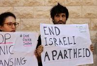 Protesters hold signs during a hearing on the possible evictions of Palestinian from the Sheikh Jarrah neighborhood of Jerusalem, outside the Supreme Court in Jerusalem, Monday, Aug. 2, 2021. (AP Photo/Maya Alleruzzo)