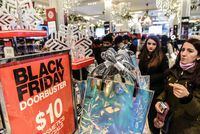 People shop during a Black Friday sales event at Macy's store on 34th St. in New York on Nov. 22, 2018.