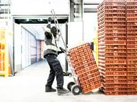 Kirk McCormack loads items onto a truck for delivery at, Flanagan's Foodservice, in Ajax, Ont., on Tues., April 7, 2020. Food distributors that have served the restaurant industry are now selling to grocery retailers struggling to restock their shelves.
