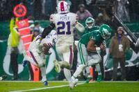 Philadelphia Eagles quarterback Jalen Hurts scores the game winning touchdown against the Buffalo Bills during overtime in an NFL football game Sunday, Nov. 26, 2023, in Philadelphia. (AP Photo/Matt Rourke)
