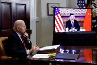 FILE PHOTO: U.S. President Joe Biden speaks virtually with Chinese leader Xi Jinping from the White House in Washington, U.S. November 15, 2021.  REUTERS/Jonathan Ernst