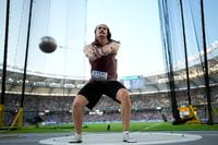 Ethan Katzberg, of Canada,makes an attempt in the Men's hammer throw final during the World Athletics Championships in Budapest, Hungary, Sunday, Aug. 20, 2023. (AP Photo/Bernat Armangue)